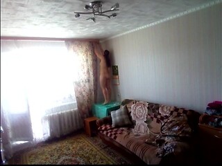 My naked stepmom hangs a curtain and exposes her curvy body