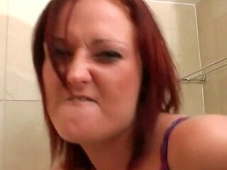 Redhead Takes Cumshot In Bathroom