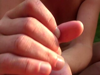 Amateur MILF enjoys public balcony handjob with cum on her tits