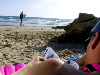 Young girl in sunglasses enjoys a sunny day on the beach before two lucky