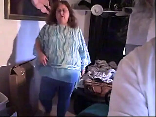 BBW redhead in blue outfit shows off her curves while dancing and taking