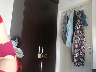 Sexy Latina Having Fun Trying on Clothes and Cutting Them