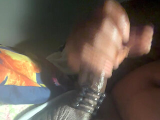 Black man masturbating with a cock ring