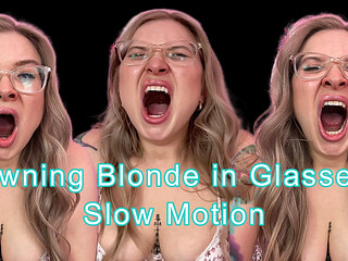 Yawning Blonde with Glasses in Slow Motion