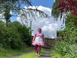 Dressed in her new pink maid outfit for a day
