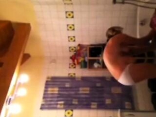 Spying on stepmom as she lotions her body