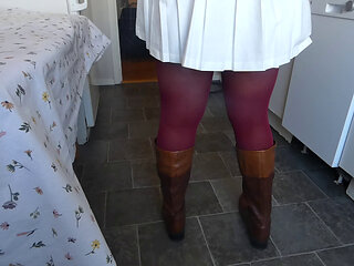 Peeing in red pantyhose on the kitchen table