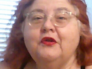 Mature BBW Redhead Nurse Vicki Talks to You as She Makes a Lipstick Applying Video for You!
