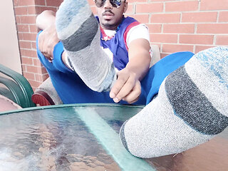 I touch and show my male feet in the solarium (2025)