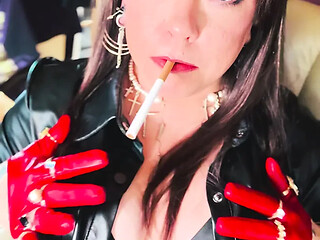 British MILF Tina Snua smokes a cigarette in her short leather gloves and rings.