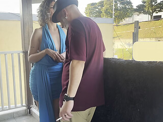 Strangers making out on a balcony during the party.