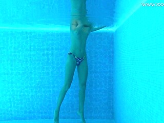 Very fit Russian babe Mary Kalisy shows off her hot body in a nude swim