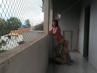 My wife teasing me on balcony