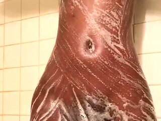 Sexy amateur chick taking a shower and masturbating