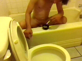 Pissing in the Toilet While Standing on the Bathtub