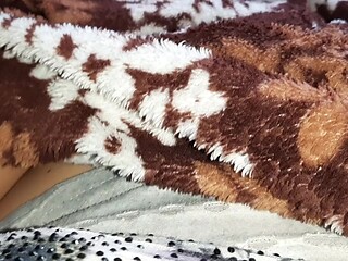 Naughty MILF mashes under the blanket during risky self pleasure