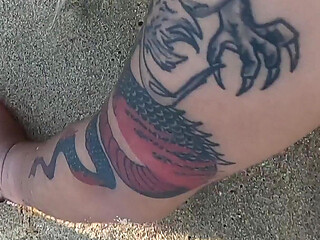 Tattooed MILF Nery Takes Hard Doggy Pounding on Beach