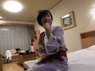 Mature woman enjoys a sensual and hot spring session in the daytime.