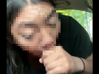 Asian giving head to BBC while driving