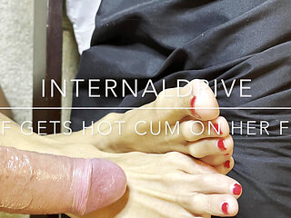 Milf gets hot cum on her feet and licks it off.