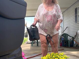 Watering Flowers Flashing Tits and Ass
