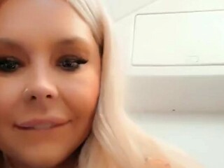 Blonde MILF gets fucked with a vodka bottle on the plane