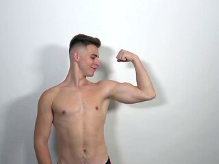 Muscle boy Jonathan Hicks shows his abs