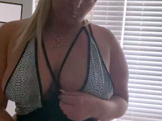 Mature blonde masturbates with sex toy in porn movie