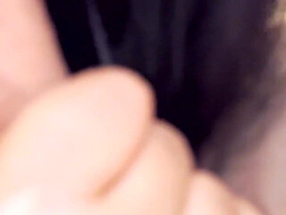 A girl with a tattoo on her arm licks her boyfriend's dick at home