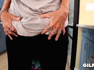 Granny in Floral Dress Kneels to Suck Inked Bearded Studs Throbbing Cock Before Riding
