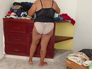 Chubby Mom Tidying Up Room And Folding Laundry 2