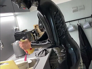 Latex maid service in high heels and chains