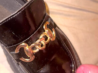 Cumming on patent loafers