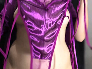 A YOUNG GIRL WEARING A PAIR OF SCARLET LINGERIE AND A PAIR OF SCISSORS