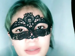 Beautiful girl in a mask enjoys some alone time with her hand and gets off
