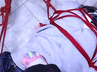The Lovely Girlfriend Is Bound by Gloves, a Collar, and a Gag