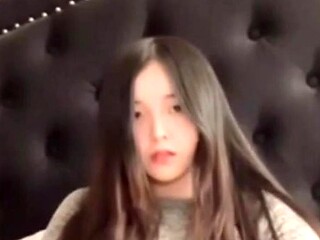 Long-haired beauty masturbates and teases