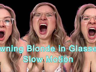 Yawning Blonde with Glasses in Slow Motion
