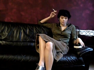 Black haired teen smoking a cigarette