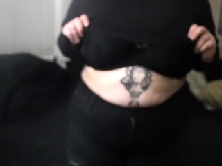 Goth GF shows off big tits in a steamy strip tease
