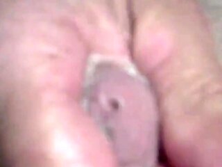 Twink's Webcam Handjob: Small Cock, Big Condom Fun