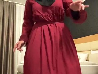 Fatima dancing in hotel room