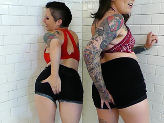 NIKKISFETISHES Two tattooed brunettes in lingerie pose together inside tiled bathroom