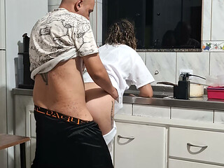 Banging the maid from behind in the kitchen.