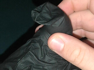 Cumming into a latex glove