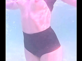 Amateur long legs perfect body girl'_s relaxing underwater swimming