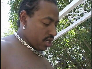 Thick black freak rides throbbing pecker until busting a nut on face