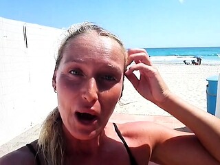 Outdoor solo masturbation scene with curly blonde