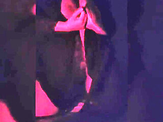 Naughty Brunette in the Dark Room Doing Stripetese