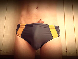 growing erection in swimming trunks